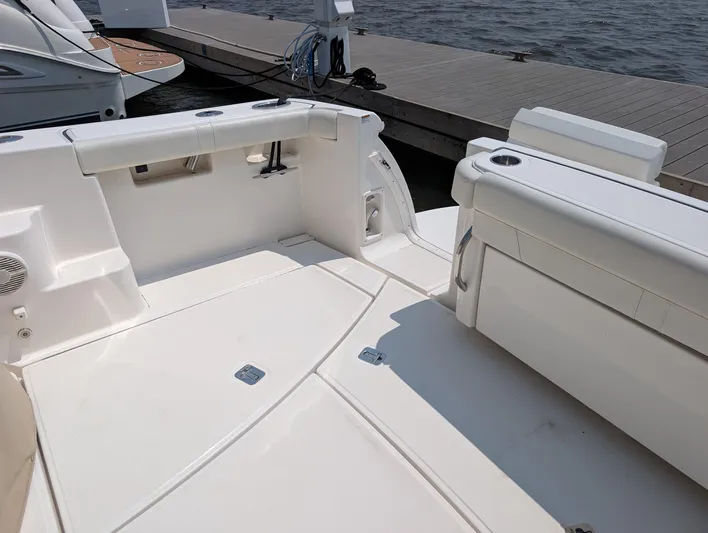 Finale Yacht Photos Pics 2015 Tiara Yachts 3100 Open boat interior, featuring spacious seating and dockside view.