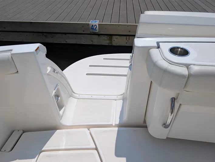 Finale Yacht Photos Pics 2015 Tiara Yachts 3100 Open boat interior with white seating and dock view.