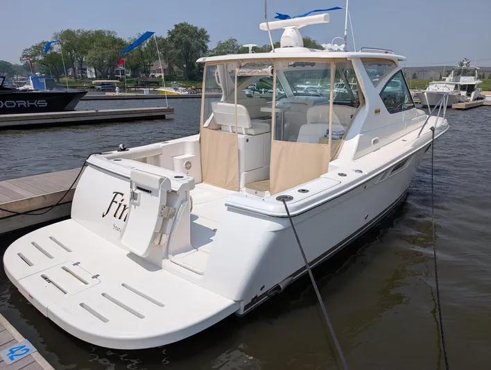 Finale Yacht Photos Pics 2015 Tiara Yachts 3100 Open docked, showcasing sleek design and spacious deck.