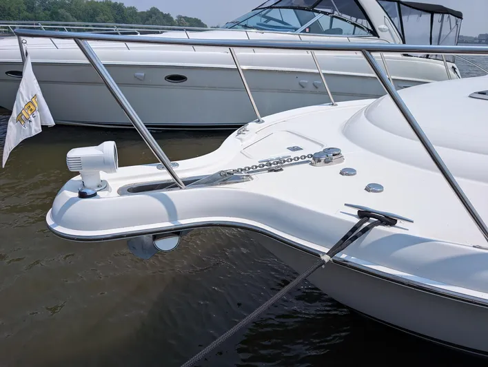 Finale Yacht Photos Pics 2015 Tiara Yachts 3100 Open bow with anchor chain and railing in marina.