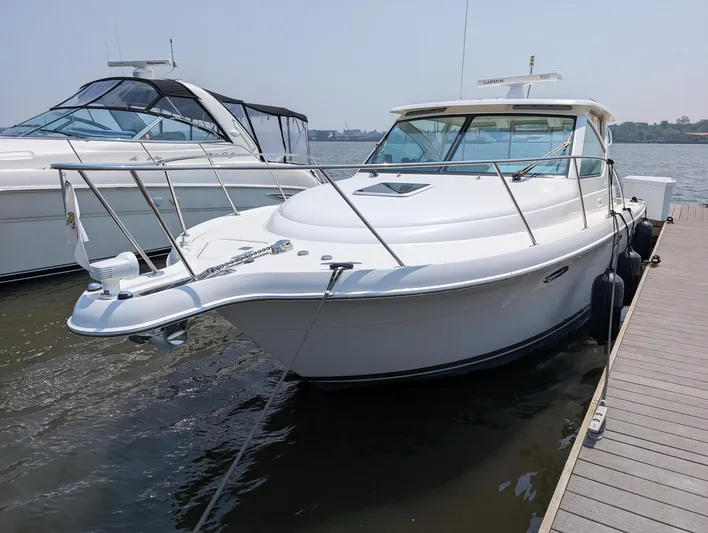 Finale Yacht Photos Pics 2015 Tiara Yachts 3100 Open docked, sleek white design, luxury motorboat.