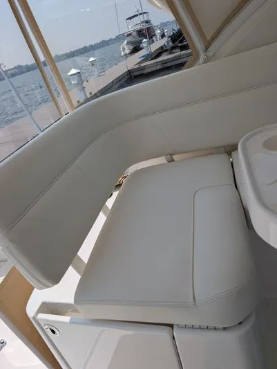 Finale Yacht Photos Pics 2015 Tiara Yachts 3100 Open interior seating with waterfront view.