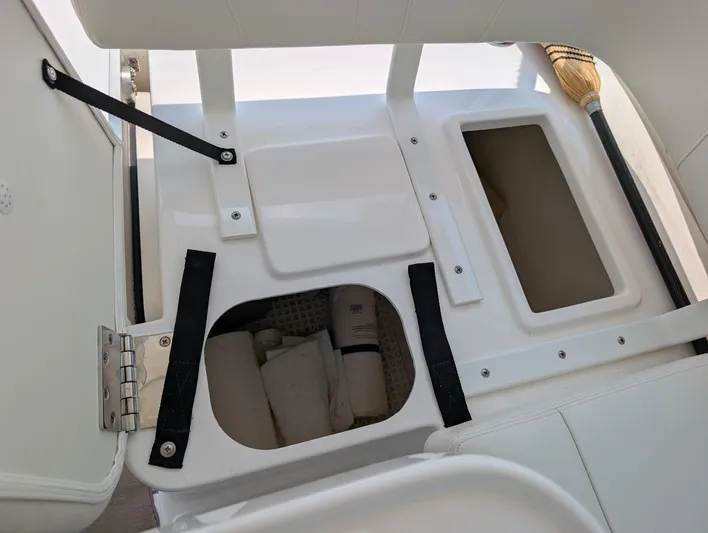 Finale Yacht Photos Pics 2015 Tiara Yachts 3100 Open storage compartments with white interior.