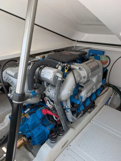Finale Yacht Photos Pics Engine compartment of a 2015 Tiara Yachts 3100 Open, showcasing detailed mechanical components.