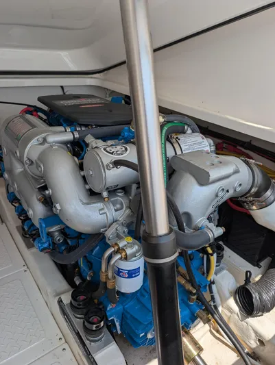 Finale Yacht Photos Pics Engine compartment of a 2015 Tiara Yachts 3100 Open, showcasing dual engines and components.