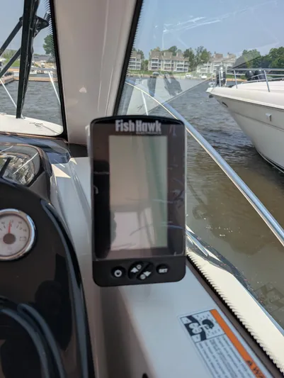 Finale Yacht Photos Pics Fish Hawk device on 2015 Tiara Yachts 3100 Open, docked by water.