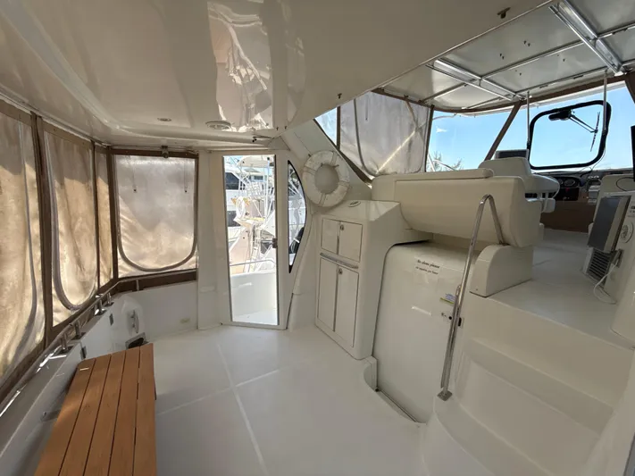  Yacht Photos Pics 2001 Carver 396 Motor Yacht interior with helm, seating, and panoramic windows.