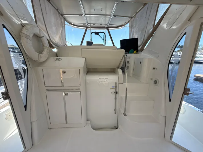  Yacht Photos Pics 2001 Carver 396 Motor Yacht interior with helm, storage, and marina view.