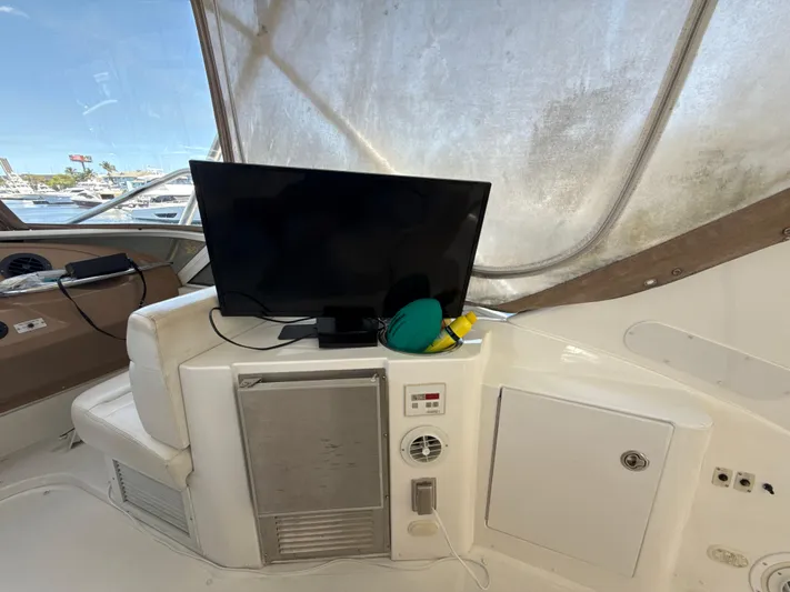  Yacht Photos Pics 2001 Carver 396 Motor Yacht interior with TV and storage compartments.