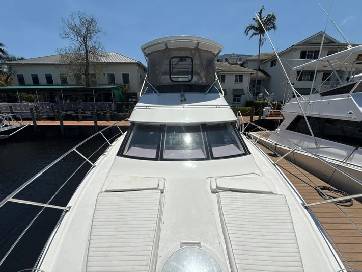  Yacht Photos Pics 2001 Carver 396 Motor Yacht docked, showcasing spacious deck and sleek design.