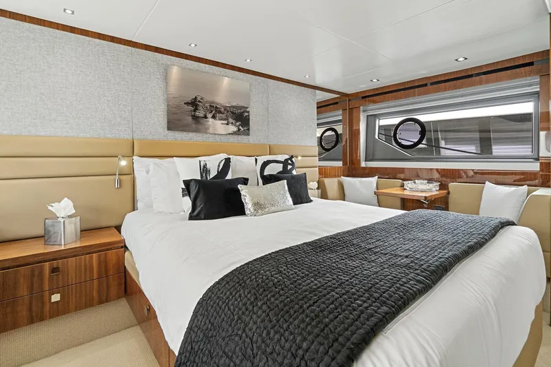 Exit Yacht Photos Pics Luxurious bedroom interior of 2019 Sunseeker Manhattan 66 yacht with elegant decor and modern amenities.