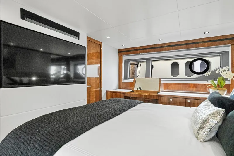 Exit Yacht Photos Pics Luxurious bedroom interior of 2019 Sunseeker Manhattan 66 yacht with modern decor.
