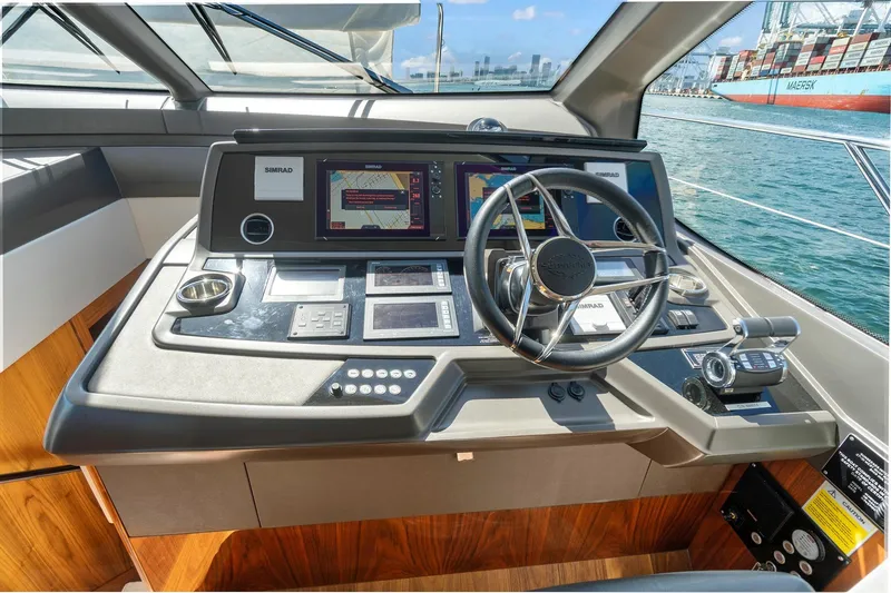 Exit Yacht Photos Pics 2019 Sunseeker Manhattan 66 yacht helm with advanced navigation systems and controls.
