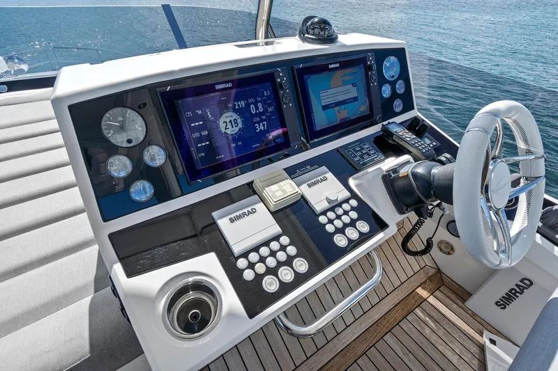 Exit Yacht Photos Pics Cockpit of 2019 Sunseeker Manhattan 66 yacht with advanced navigation systems.