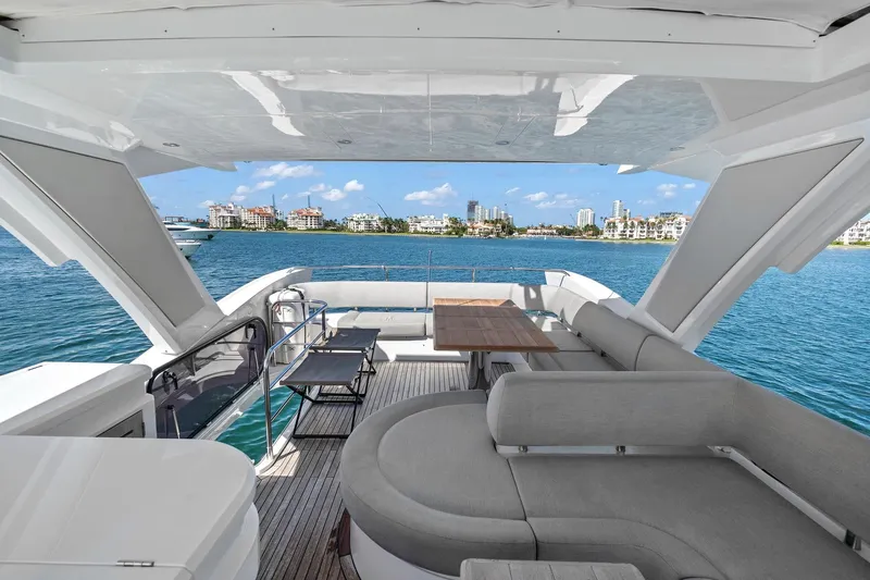 Exit Yacht Photos Pics Luxurious 2019 Sunseeker Manhattan 66 yacht interior with ocean view and modern seating.