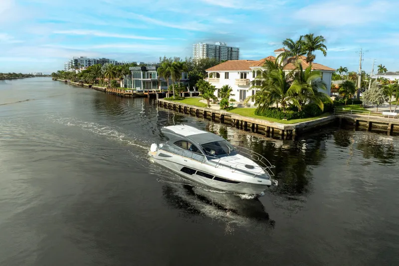  Yacht Photos Pics Luxury Valiatt 410HT yacht cruising near waterfront homes, 2025 model.