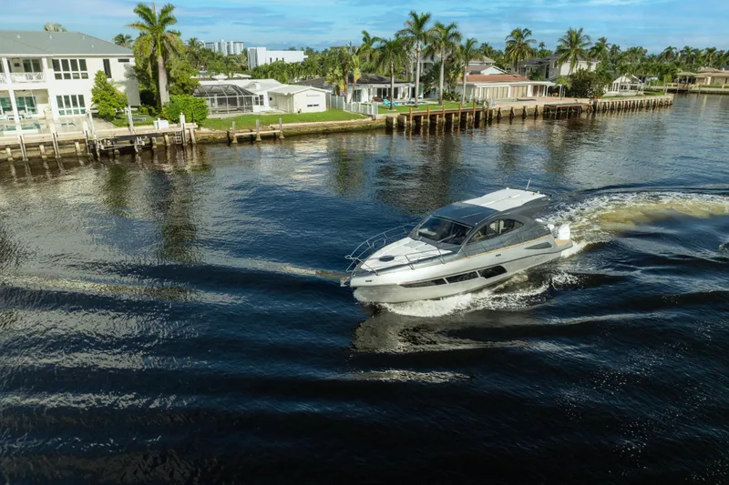  Yacht Photos Pics Luxury Valiatt 410HT yacht cruising near waterfront homes, 2025 model.