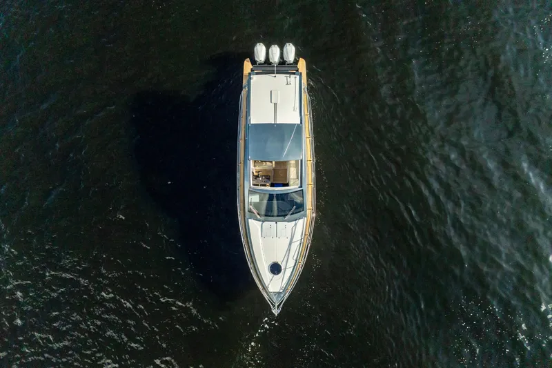  Yacht Photos Pics Top view of 2025 Valiatt 410HT yacht cruising on dark water.