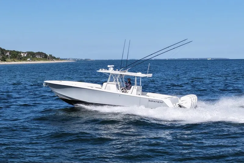 Impatient Yacht Photos Pics 2016 SeaVee 390Z boat cruising on open water with fishing rods.