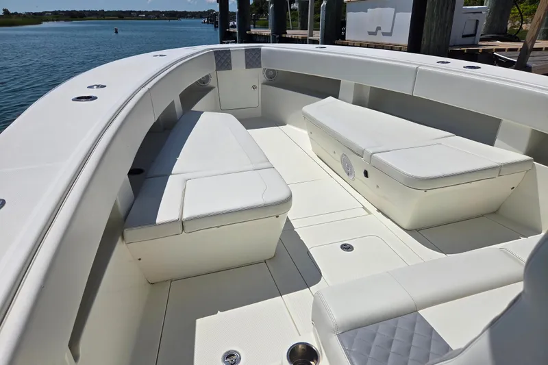 Impatient Yacht Photos Pics 2016 SeaVee 390Z boat interior with white cushioned seating and spacious deck.