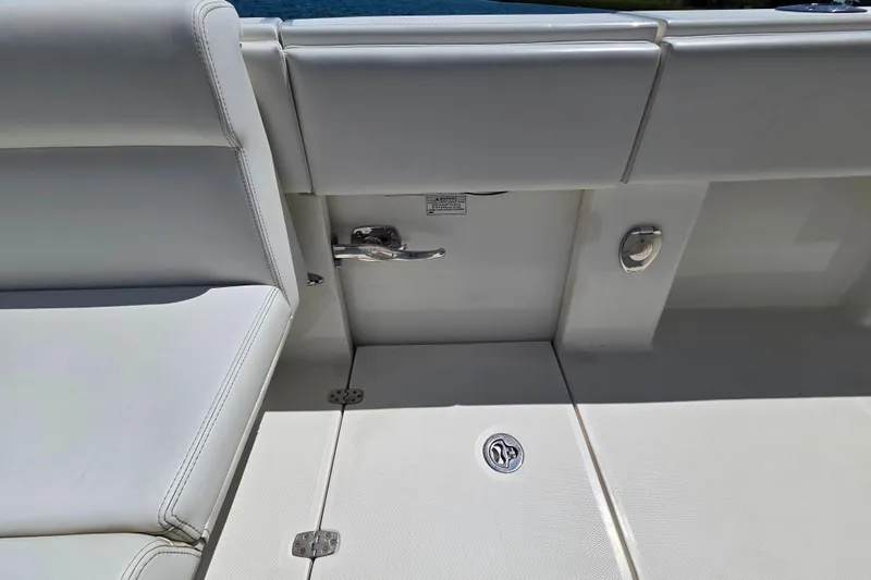 Impatient Yacht Photos Pics 2016 SeaVee 390Z boat interior, featuring white seating and deck details.