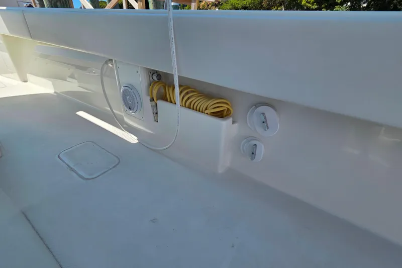 Impatient Yacht Photos Pics 2016 SeaVee 390Z boat deck with hose storage and speaker system.