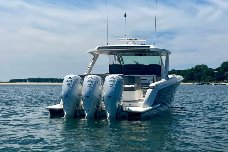 Ivernia Yacht Photos Pics 2020 Tiara Yachts 43 LS with triple outboard engines on calm water.