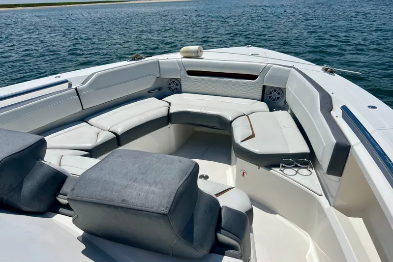 Ivernia Yacht Photos Pics Luxurious seating area on 2020 Tiara Yachts 43 LS, overlooking serene waters.