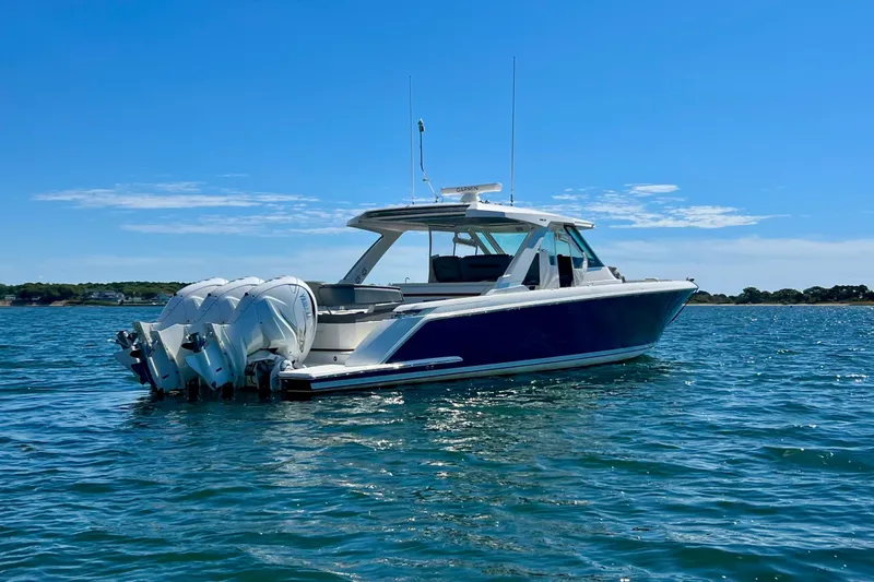 Ivernia Yacht Photos Pics 2020 Tiara Yachts 43 LS in open water, featuring sleek design and powerful engines.