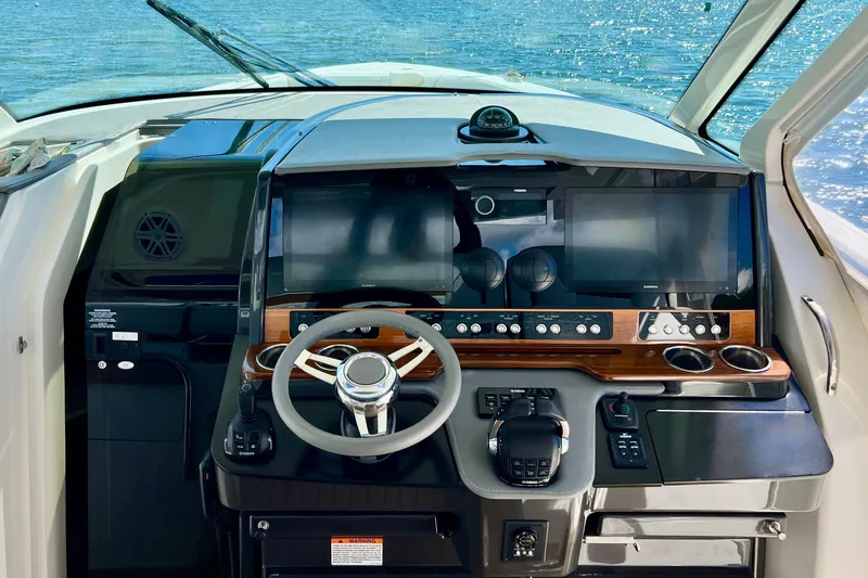 Ivernia Yacht Photos Pics Cockpit of 2020 Tiara Yachts 43 LS with modern navigation controls and steering wheel.