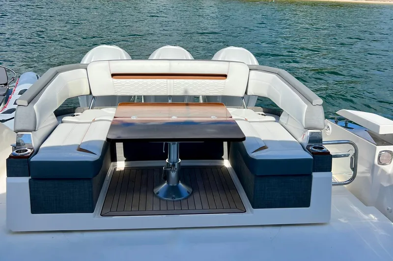 Ivernia Yacht Photos Pics 2020 Tiara Yachts 43 LS luxury yacht seating area with table, overlooking serene water.