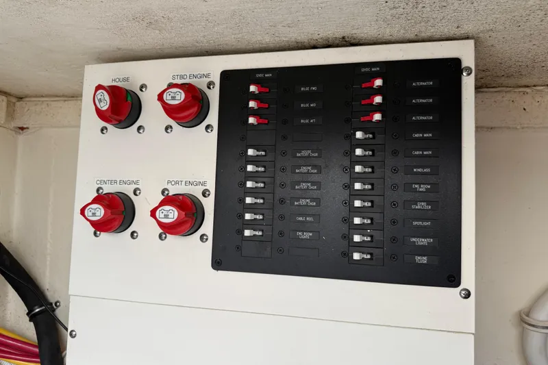 Ivernia Yacht Photos Pics Electrical panel of a 2020 Tiara Yachts 43 LS, featuring engine and battery controls.