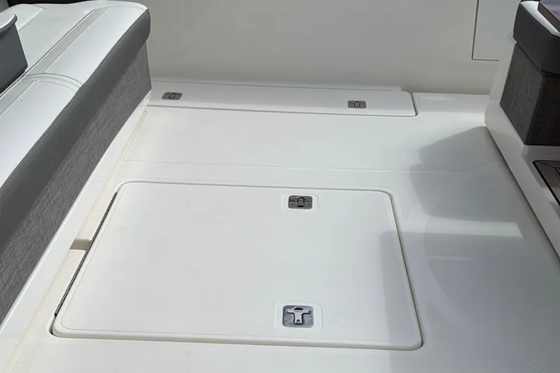 Ivernia Yacht Photos Pics 2020 Tiara Yachts 43 LS deck with storage compartments and seating area.