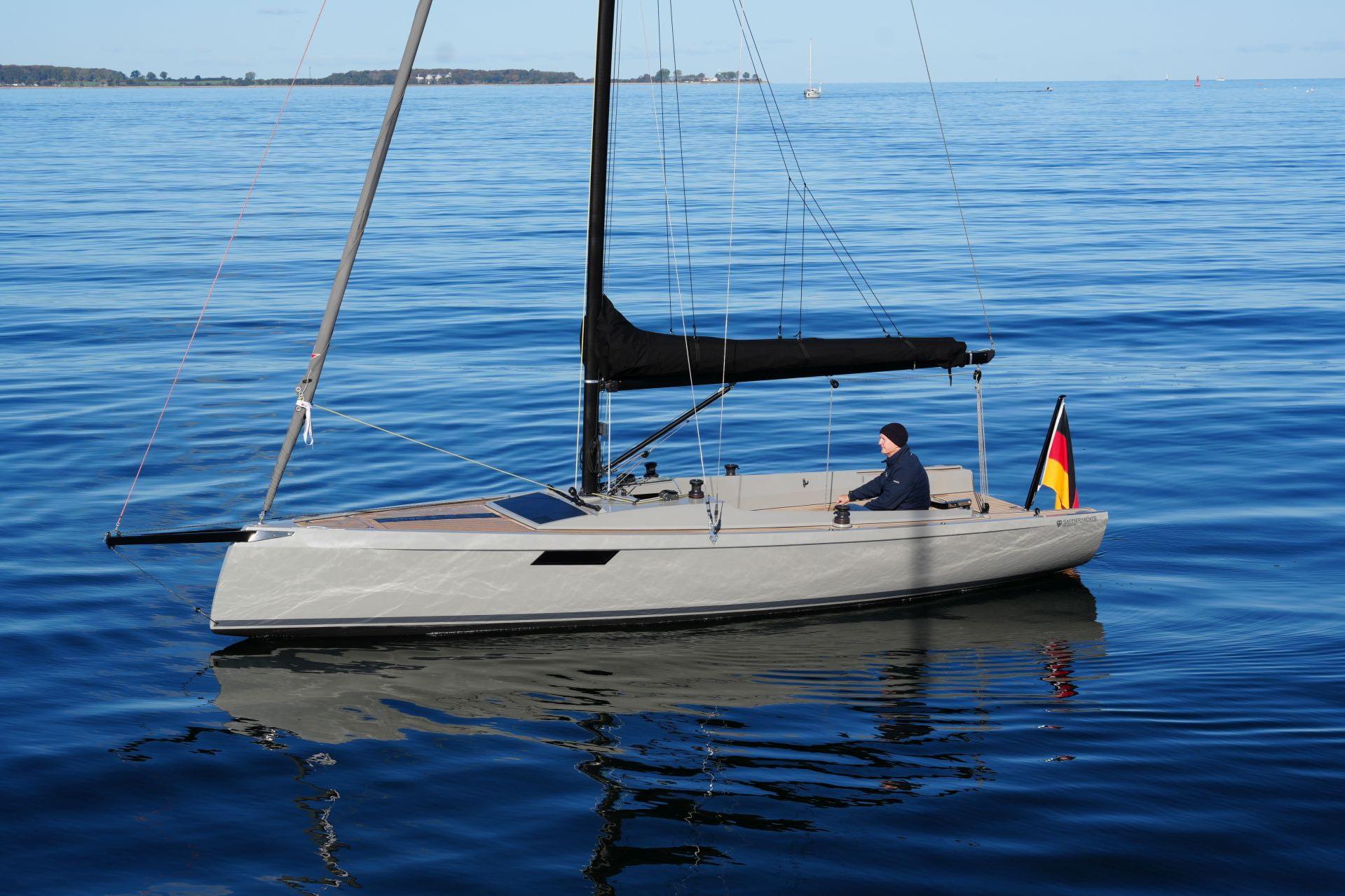 2023 Saffier SE 24 Lite sailboat on calm water, featuring sleek design and German flag.