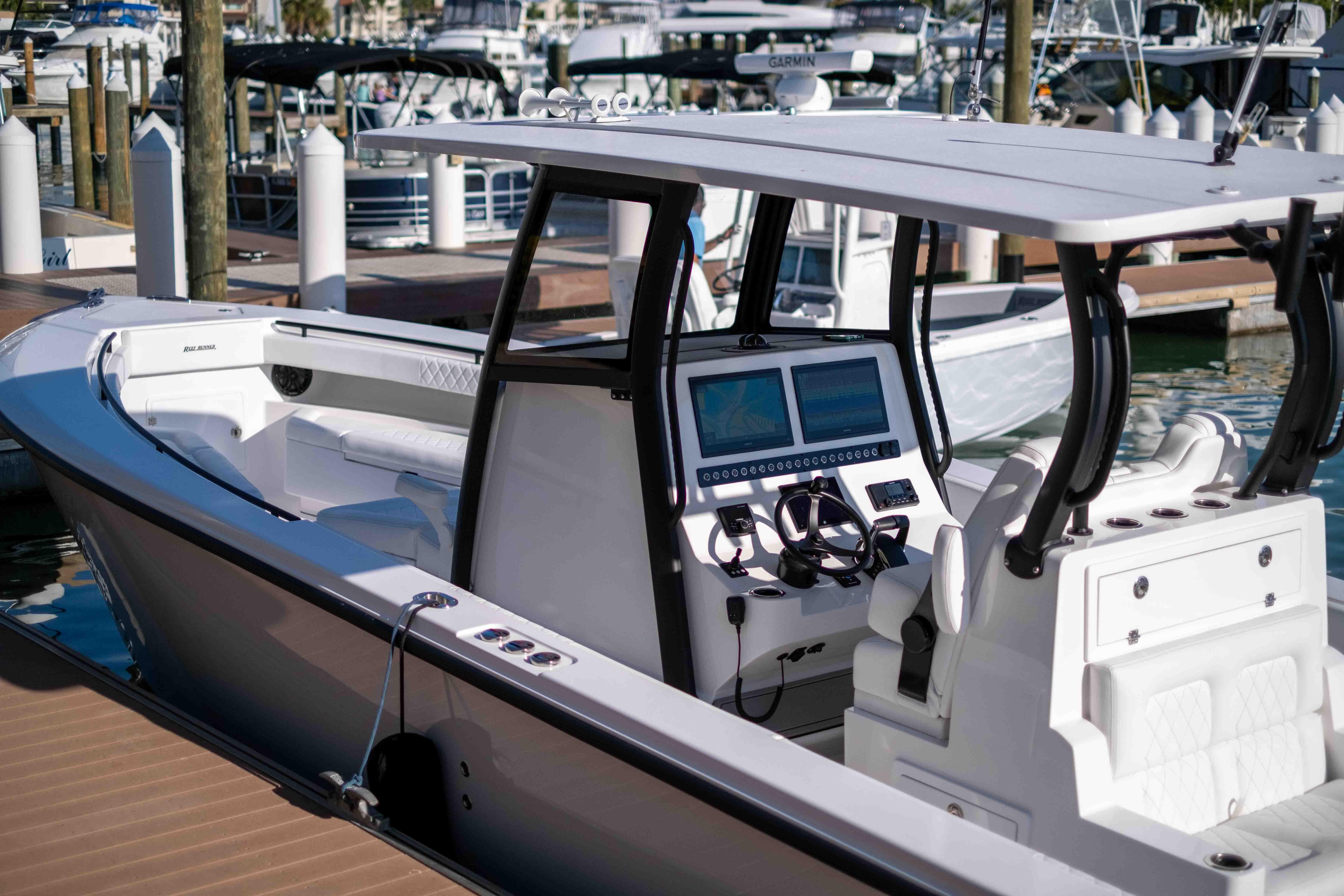 Reef Runner 340 boat 2026 at dock with modern helm console.