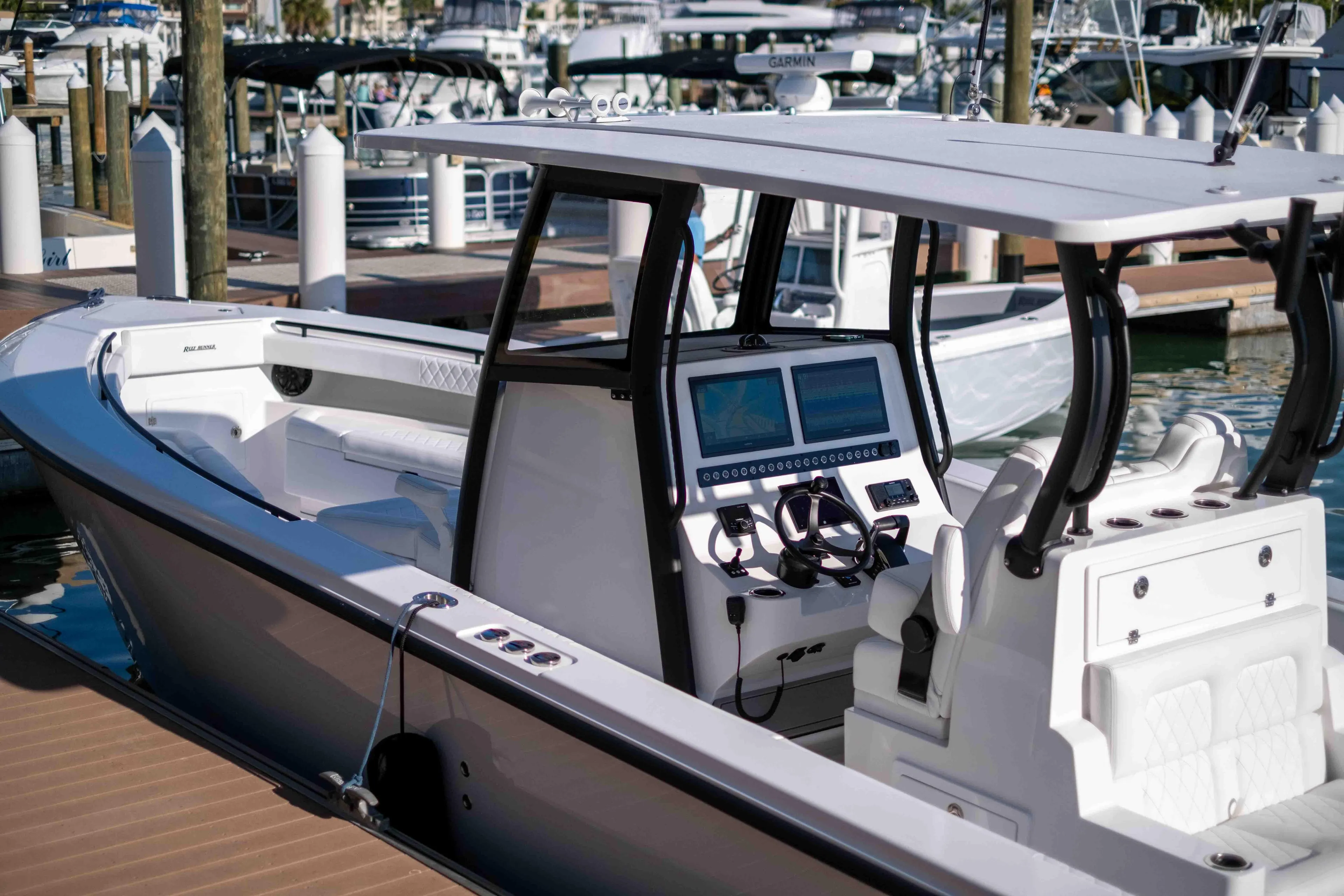 Reef Runner 340 boat 2026 at dock with modern helm console.