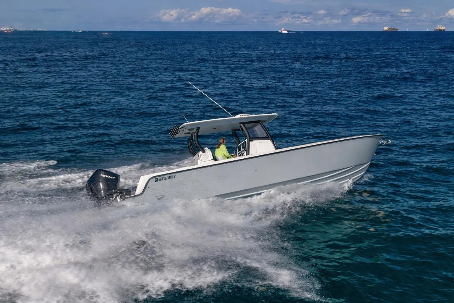 Reef Runner 340 boat 2026 cruising on open sea.