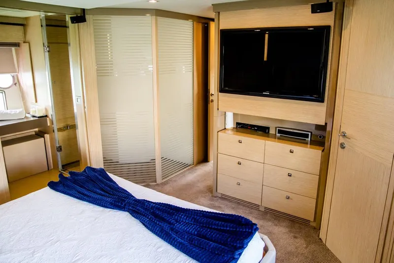  Yacht Photos Pics Luxurious bedroom interior of 2013 Ferretti Yachts 720 with TV and modern furnishings.