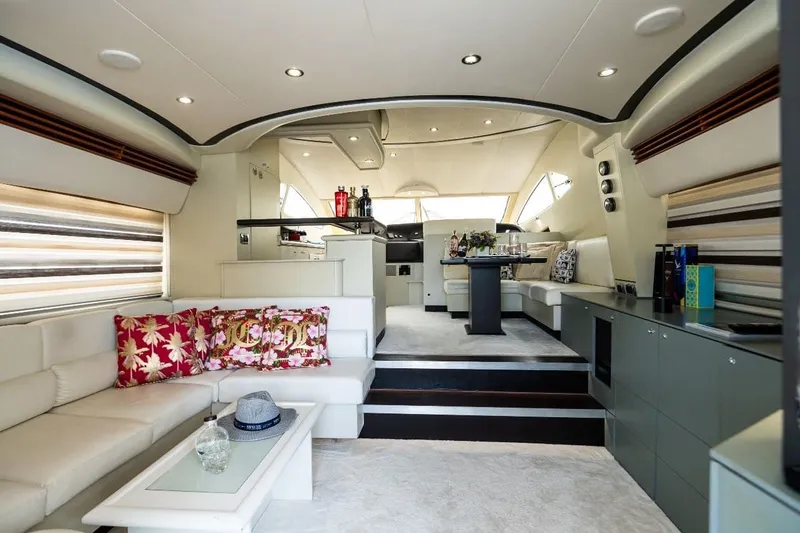  Yacht Photos Pics Luxurious interior of 2004 Aicon 56 yacht with elegant seating and modern decor.