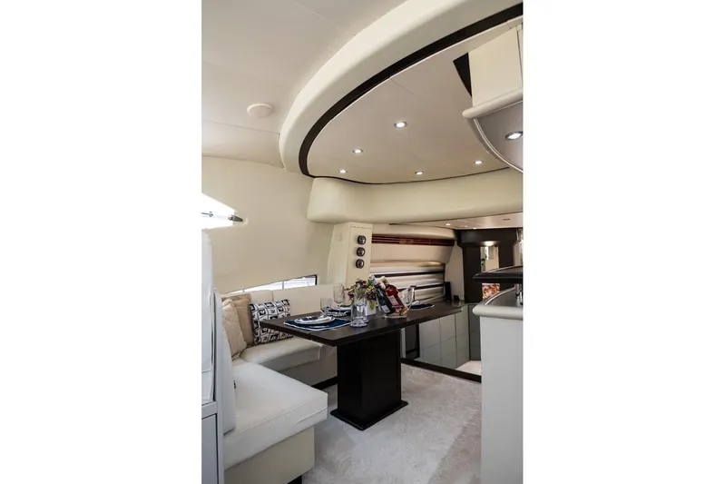  Yacht Photos Pics Luxurious interior of 2004 Aicon 56 yacht with elegant dining area and modern decor.