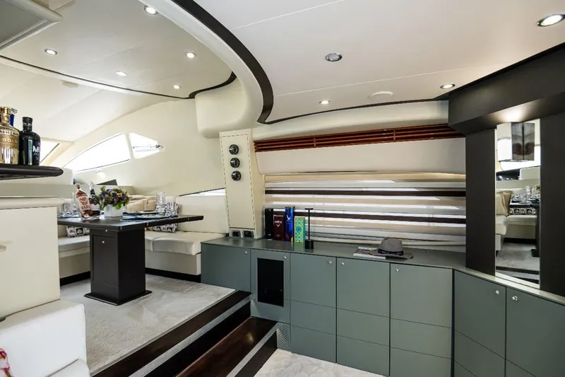  Yacht Photos Pics Luxurious interior of a 2004 Aicon 56 yacht with modern furnishings and elegant decor.