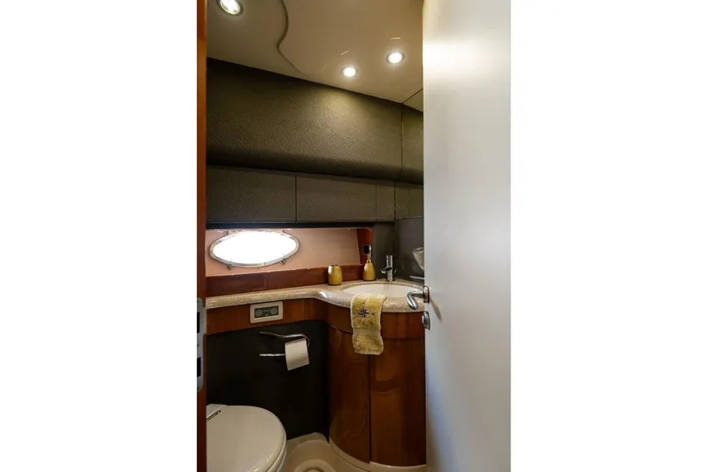  Yacht Photos Pics Luxurious bathroom interior of 2004 Aicon 56 yacht with modern fixtures and elegant design.