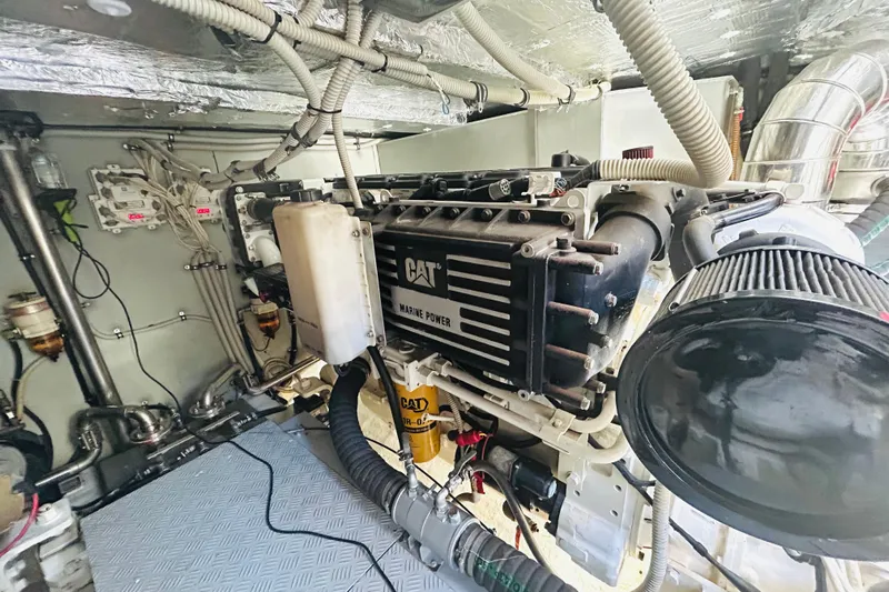 Yacht Photos Pics Engine room of a 2004 Aicon 56 yacht featuring a CAT marine power engine.