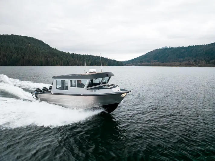  Yacht Photos Pics 2023 Liquid Metal Marine Maquinna Crew boat cruising on a scenic lake.