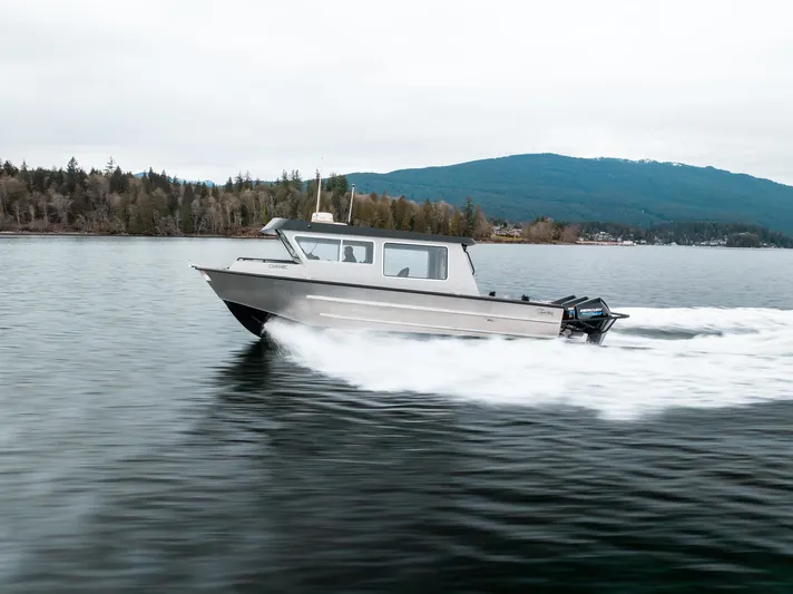  Yacht Photos Pics 2023 Liquid Metal Marine Maquinna Crew boat cruising on a serene lake.