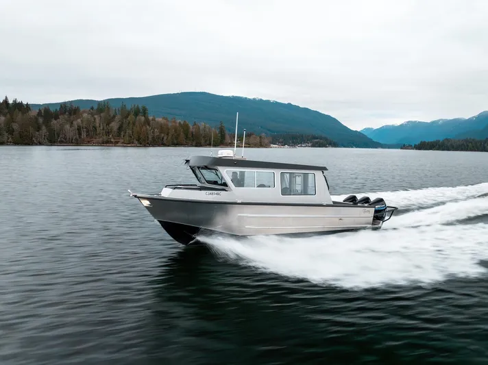  Yacht Photos Pics 2023 Liquid Metal Marine Maquinna Crew boat cruising on a scenic lake.