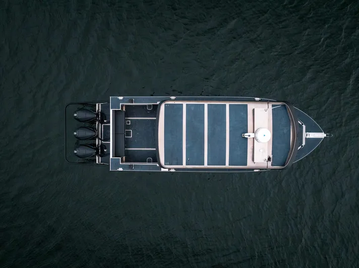  Yacht Photos Pics Aerial view of 2023 Liquid Metal Marine Maquinna Crew boat on dark water.