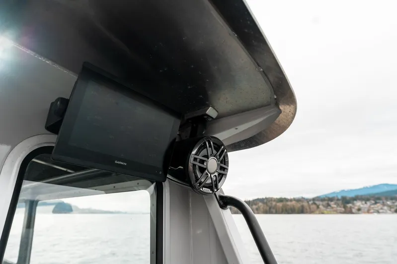  Yacht Photos Pics 2023 Liquid Metal Marine Maquinna Crew boat with monitor and speaker, coastal background.