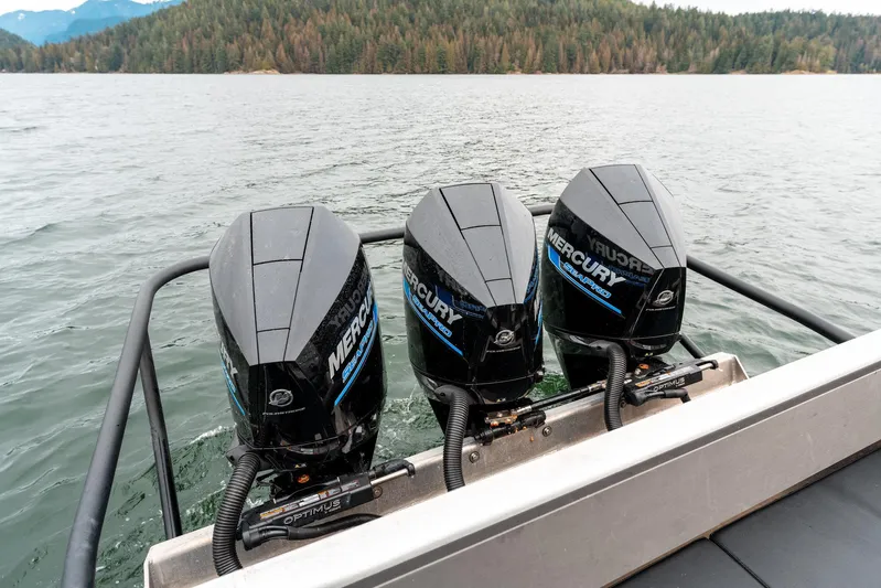  Yacht Photos Pics Triple Mercury outboard engines on a 2023 Liquid Metal Marine Maquinna Crew boat, cruising on a lake.