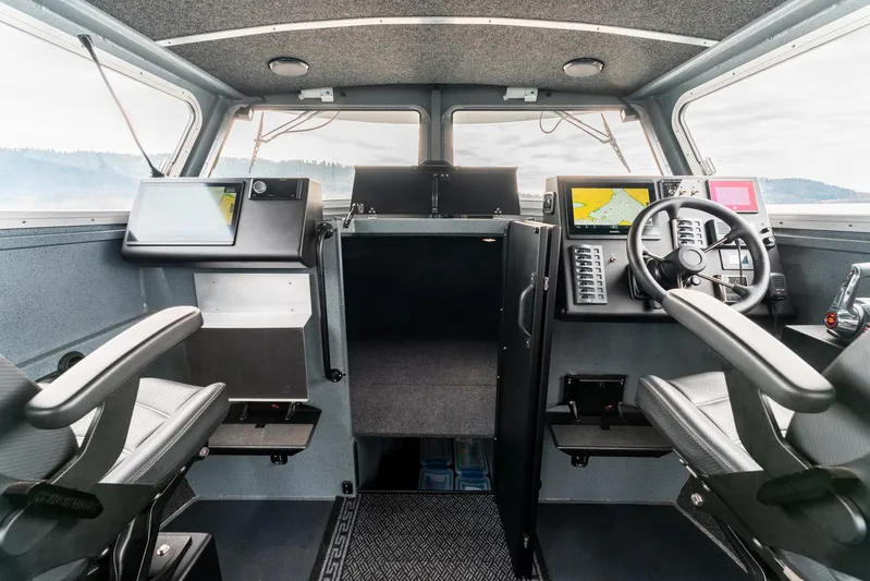  Yacht Photos Pics 2023 Liquid Metal Marine Maquinna Crew boat interior with modern navigation equipment.